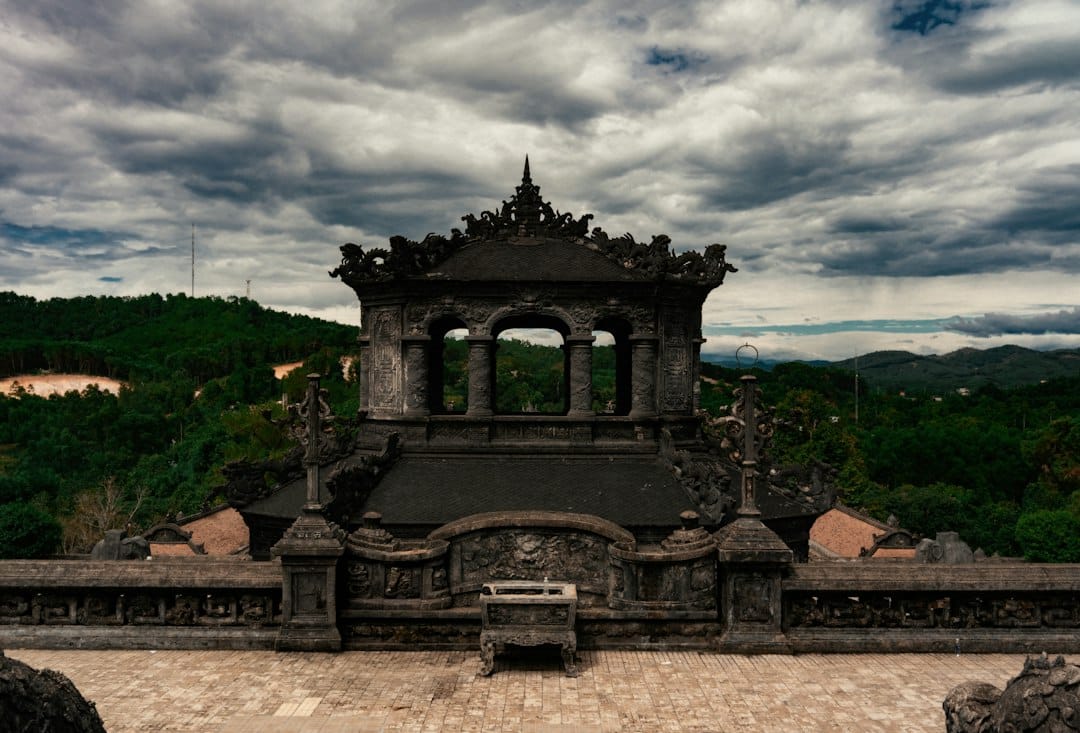 The blackened stone Thien Dinh pavilion at the hilltop Tomb of Khai Dinh