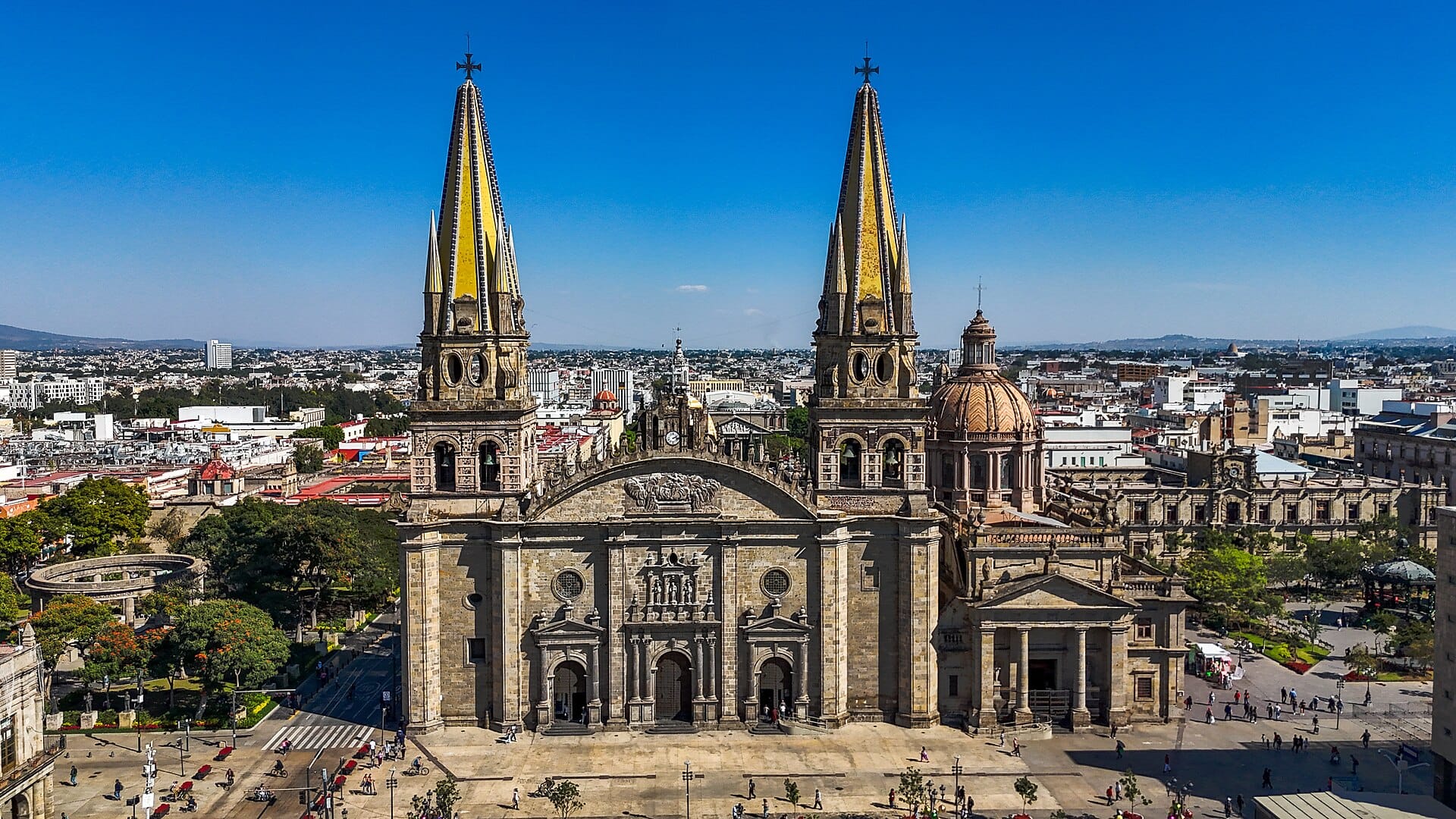 The twin neo-Gothic spires of Guadalajara Cathedral against a blue sky