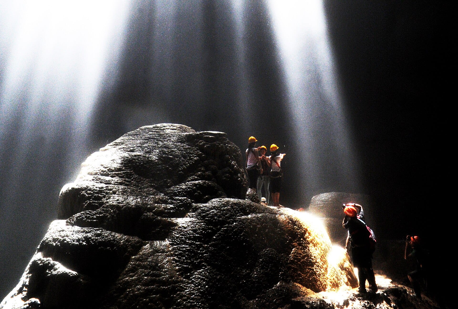 A shaft of sunlight falling into Jomblang Cave in the Gunung Kidul karst
