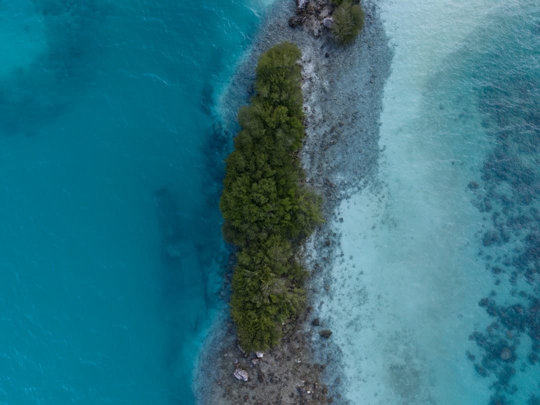 Overwater villas on stilts above a turquoise Maldives lagoon