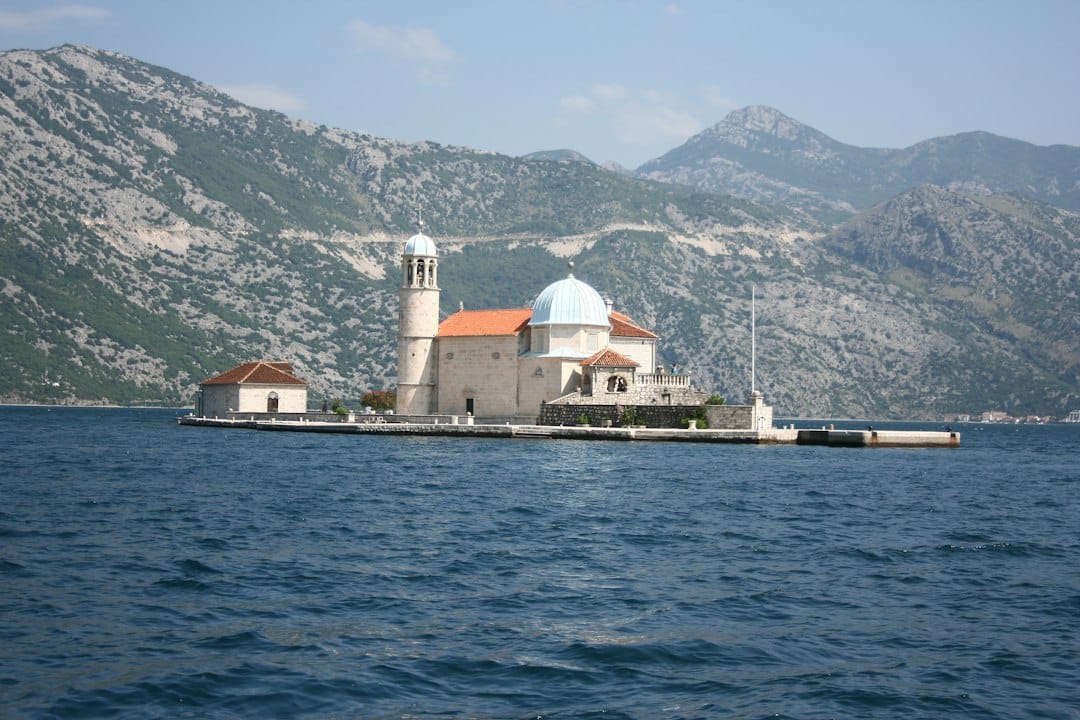 The island church of Our Lady of the Rocks near Perast in the Bay of Kotor, with mountains behind