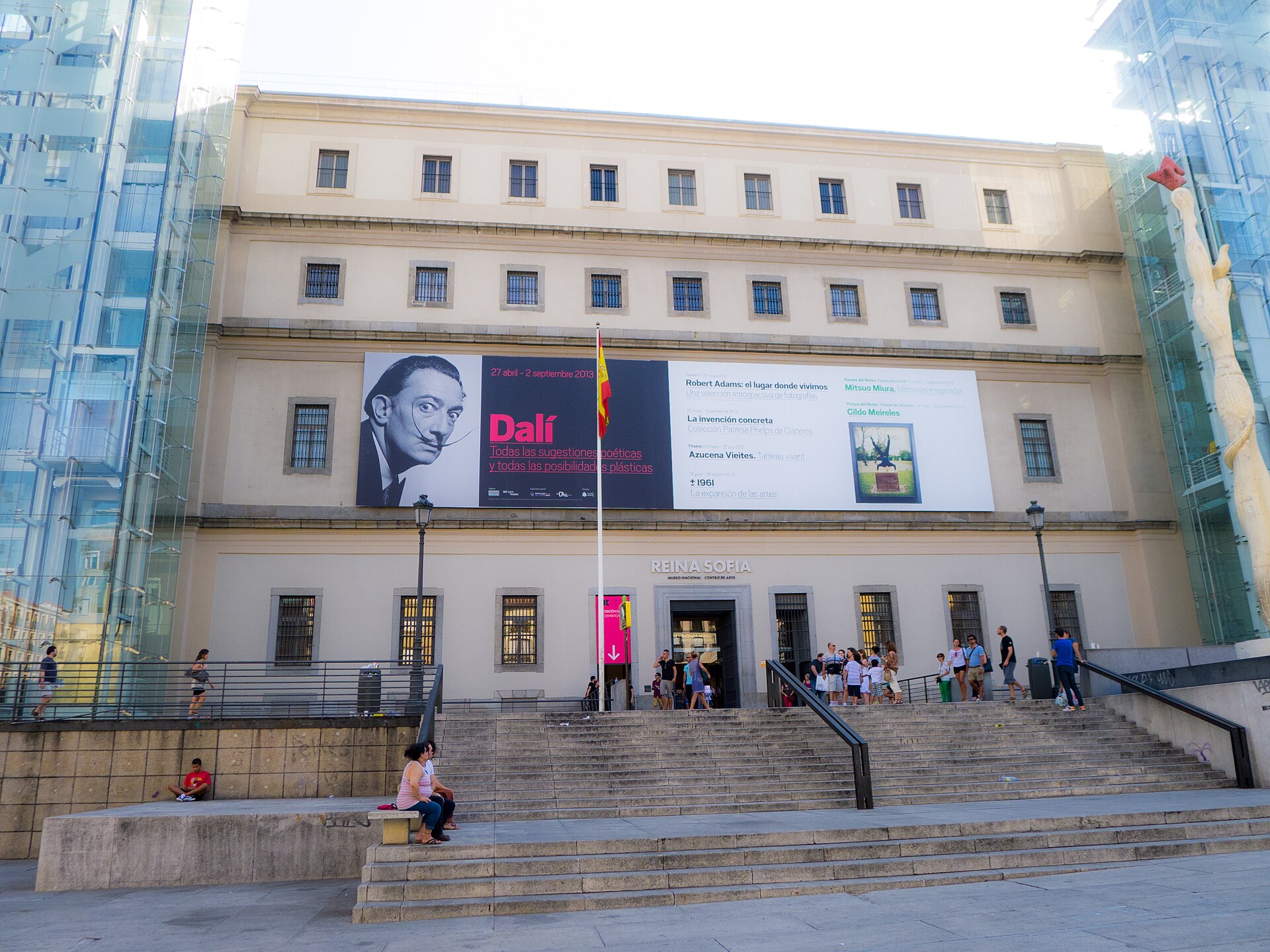 The entrance facade of the Museo Reina Sofía in Madrid with glass elevator towers