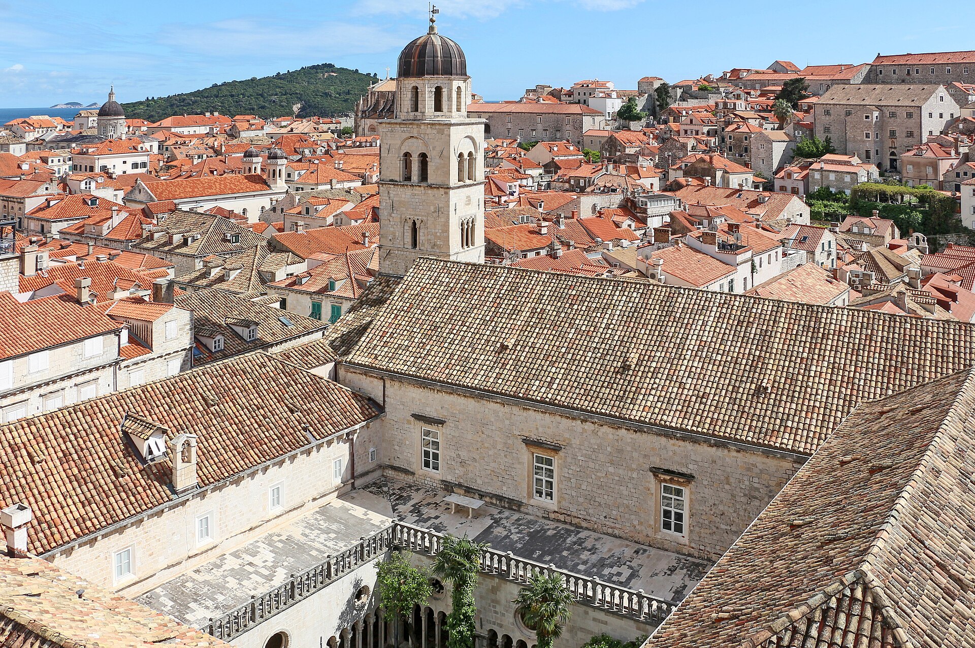 The Franciscan Monastery bell tower and cloister courtyard seen over the red roofs of Dubrovnik's Old Town