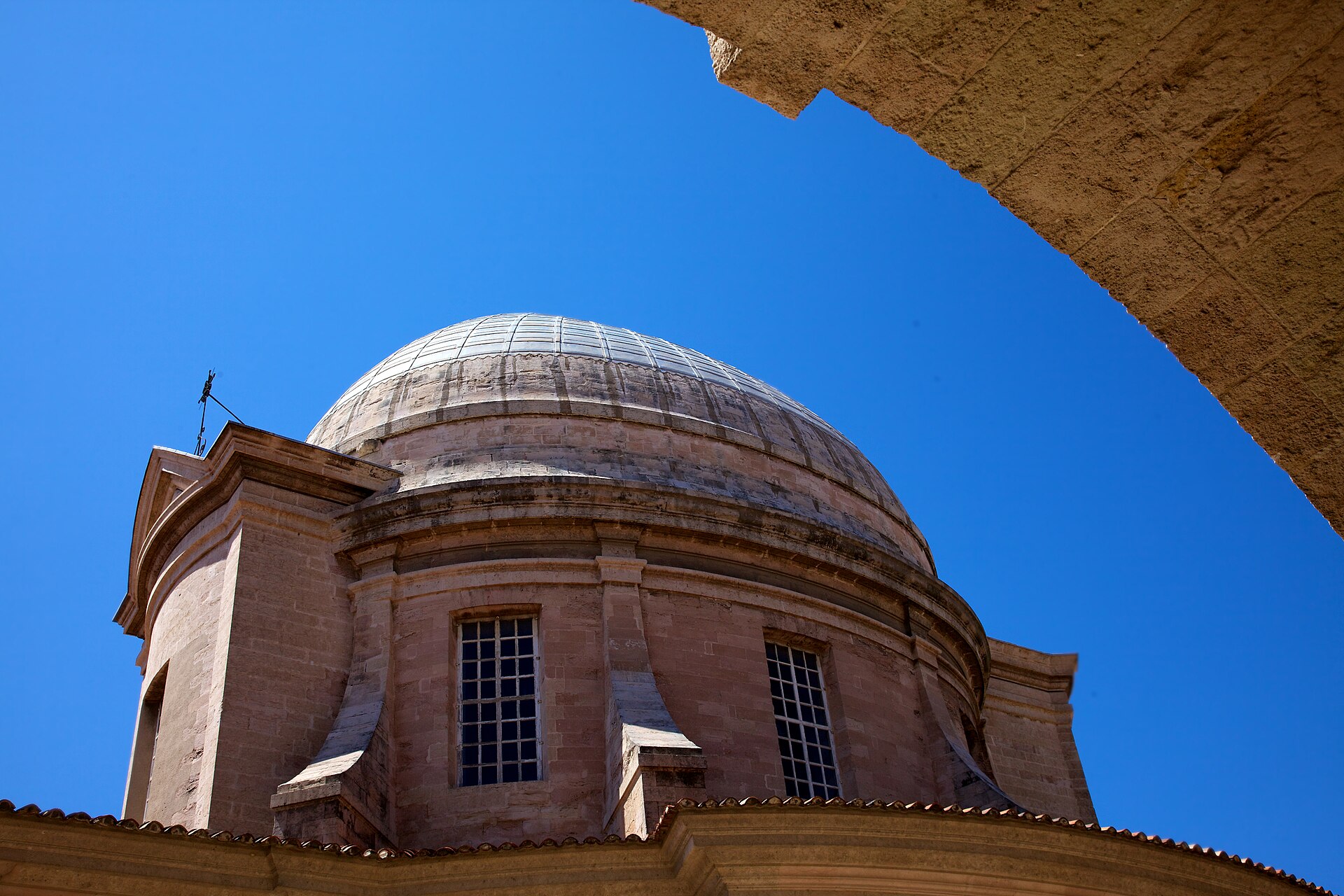 The arcaded Baroque courtyard and chapel dome of the Vieille Charité in Le Panier, Marseille