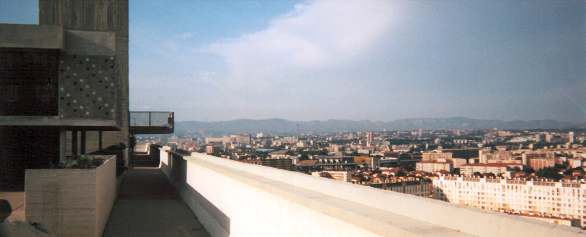 The rooftop terrace and raw concrete forms of Le Corbusier's Cité Radieuse overlooking Marseille