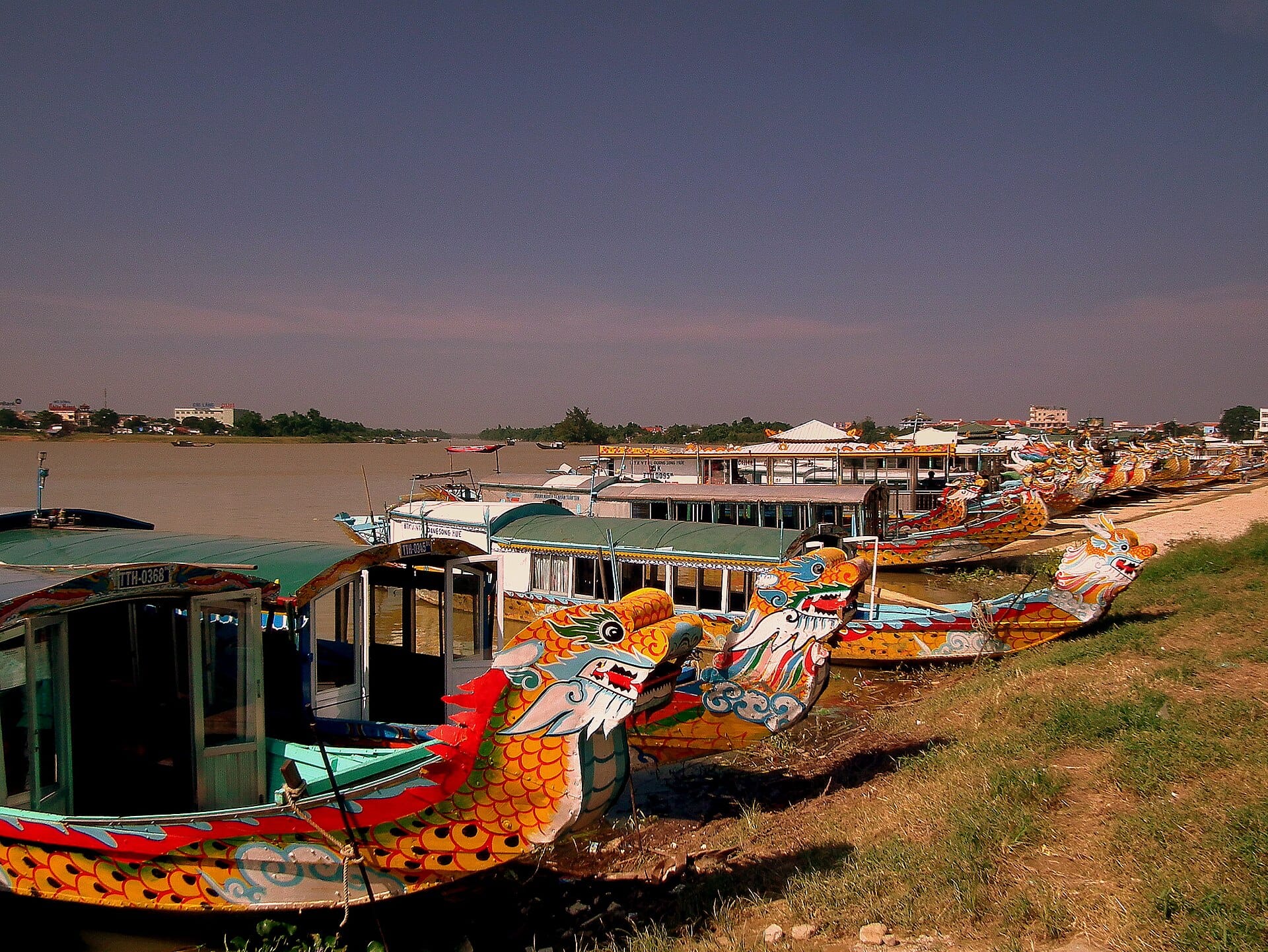 Dragon boats moored along the Perfume River in Hue
