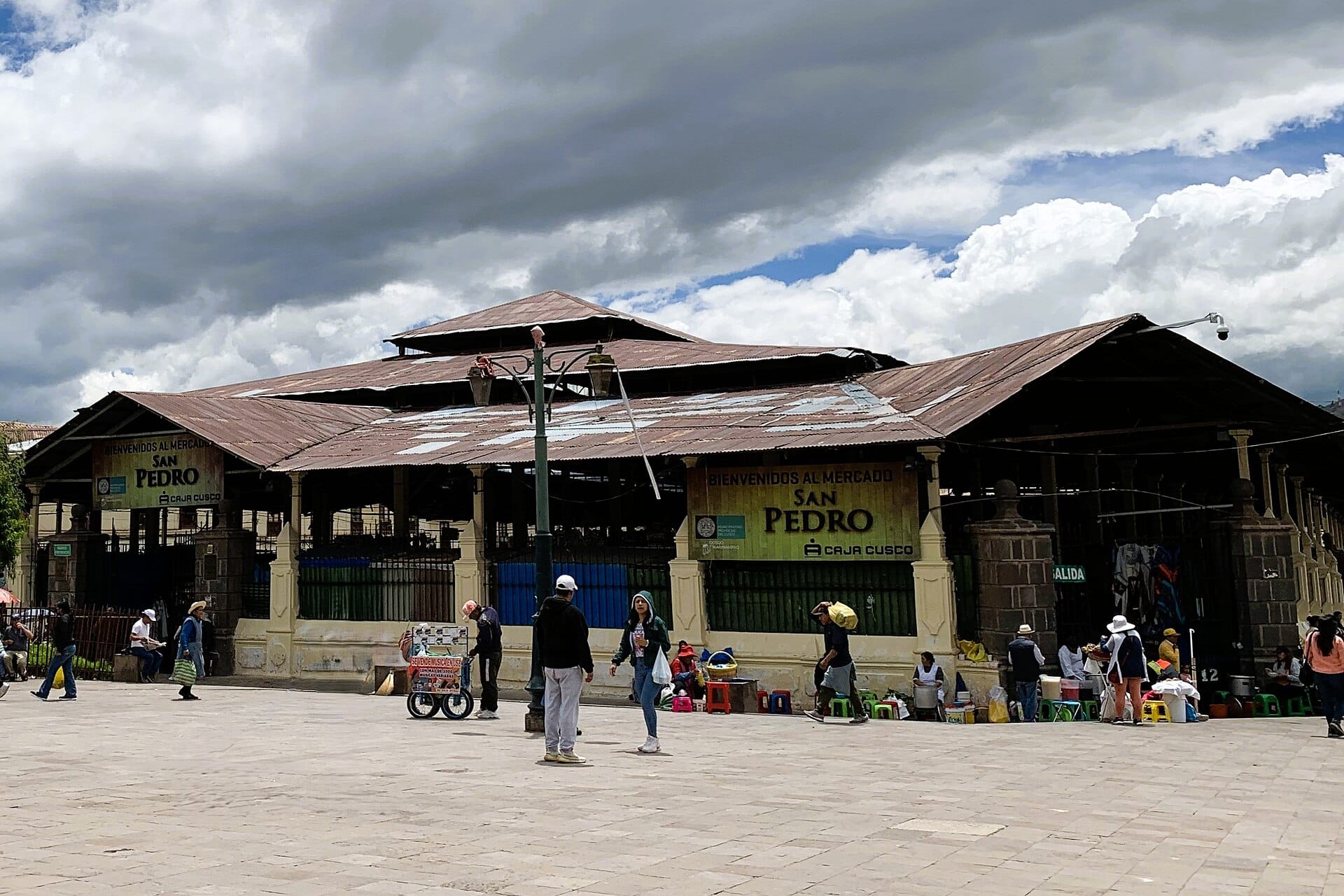 Produce and juice stalls inside the San Pedro Market in Cusco