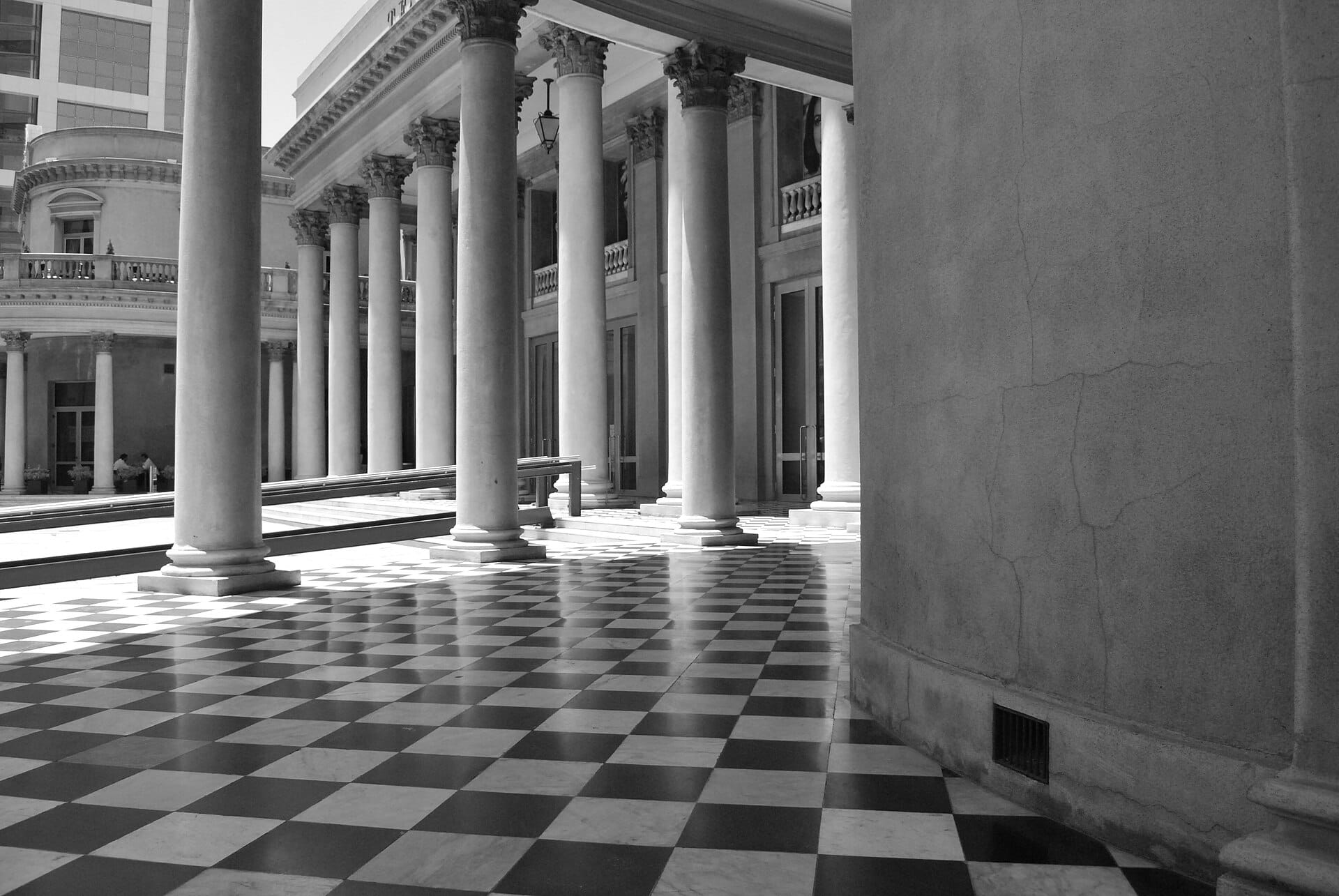 The Corinthian colonnade and checkerboard marble floor of Teatro Solis, Montevideo