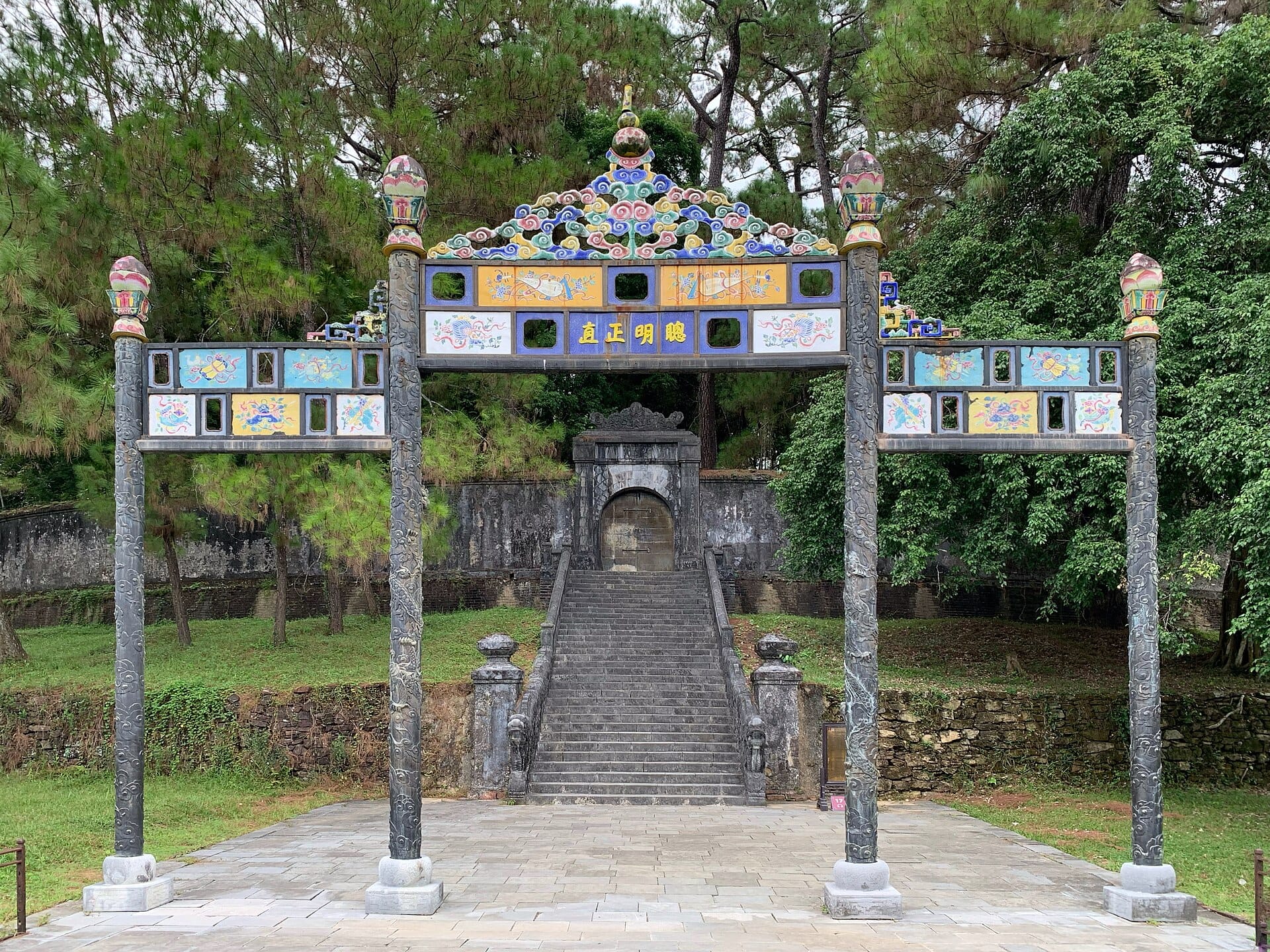 A ceramic-tiled ceremonial gate on the central axis of the Tomb of Minh Mang