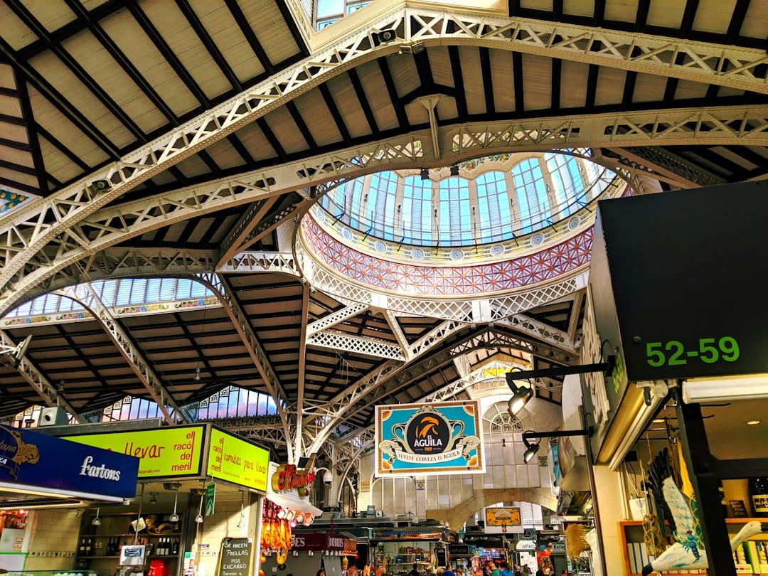 The tiled dome and stained-glass ceiling of Valencia's Central Market