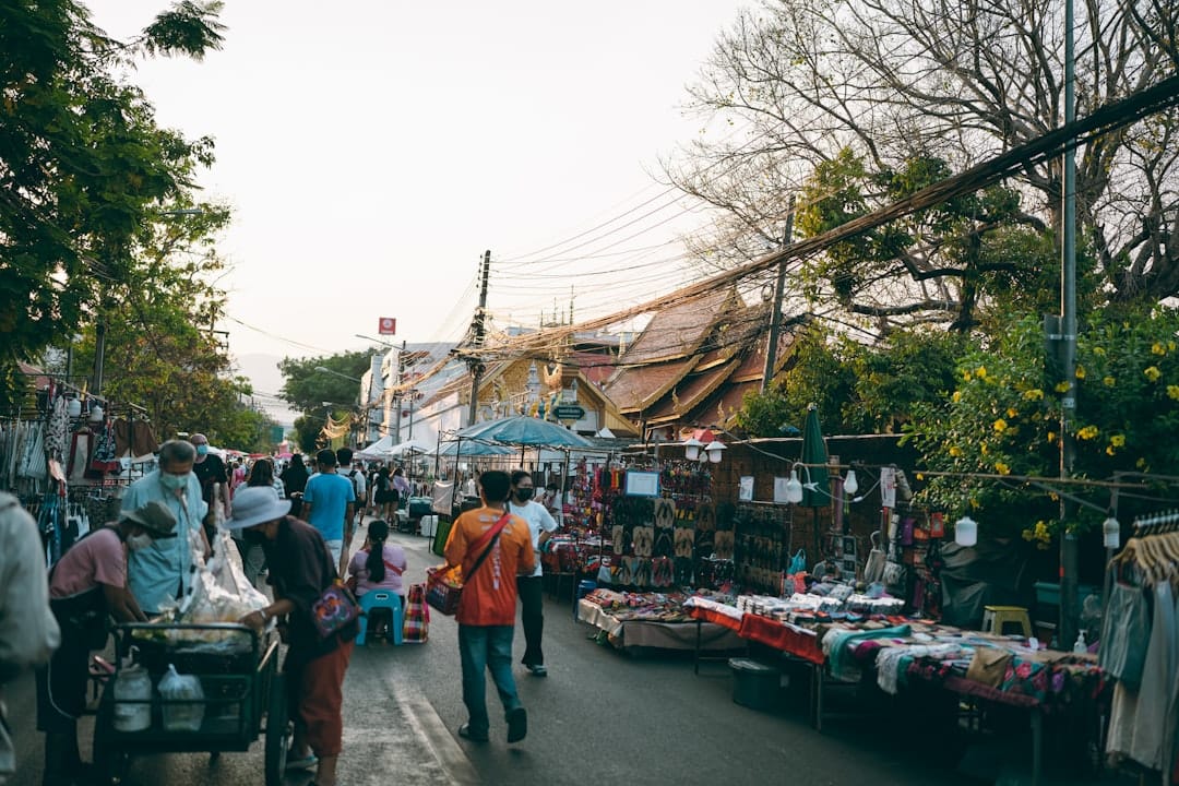 Evening crowds and street-food stalls at a Chiang Mai walking street